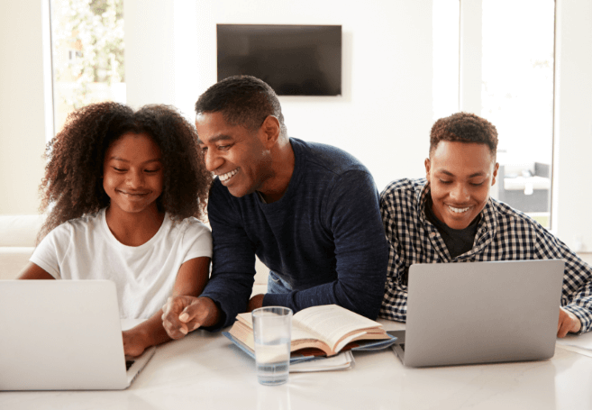 Family on laptops doing homework