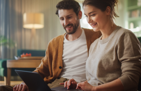 Man and woman looking at laptop