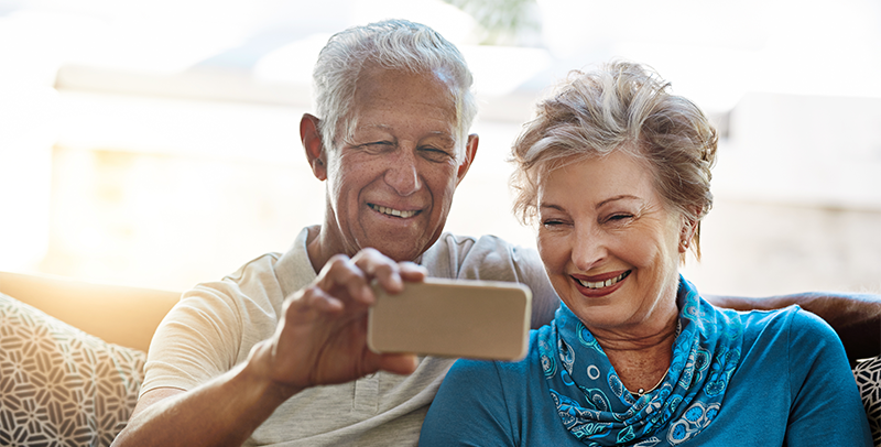 Man and Woman Looking at Phone